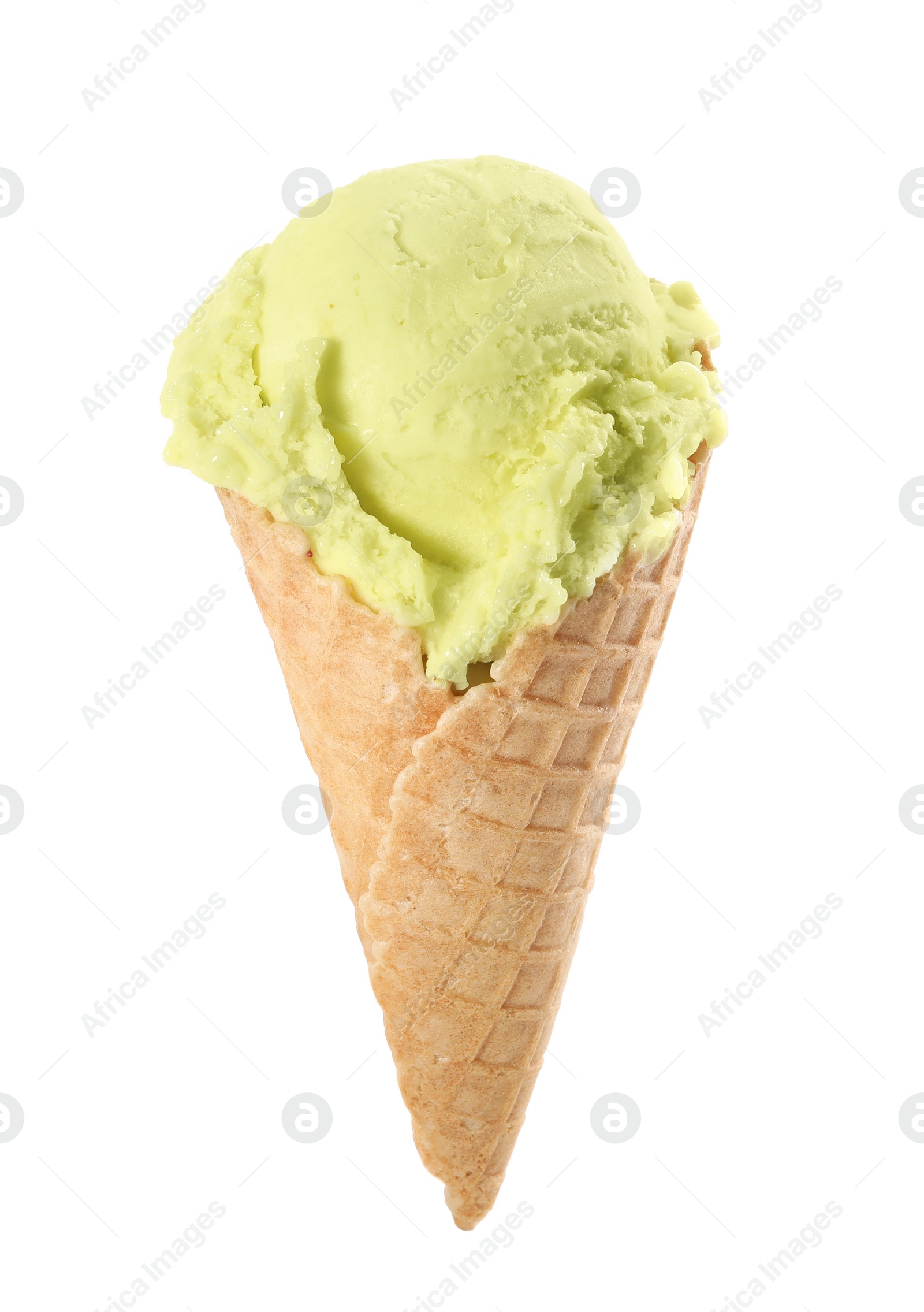 Photo of Delicious yellow ice cream in waffle cone isolated on white