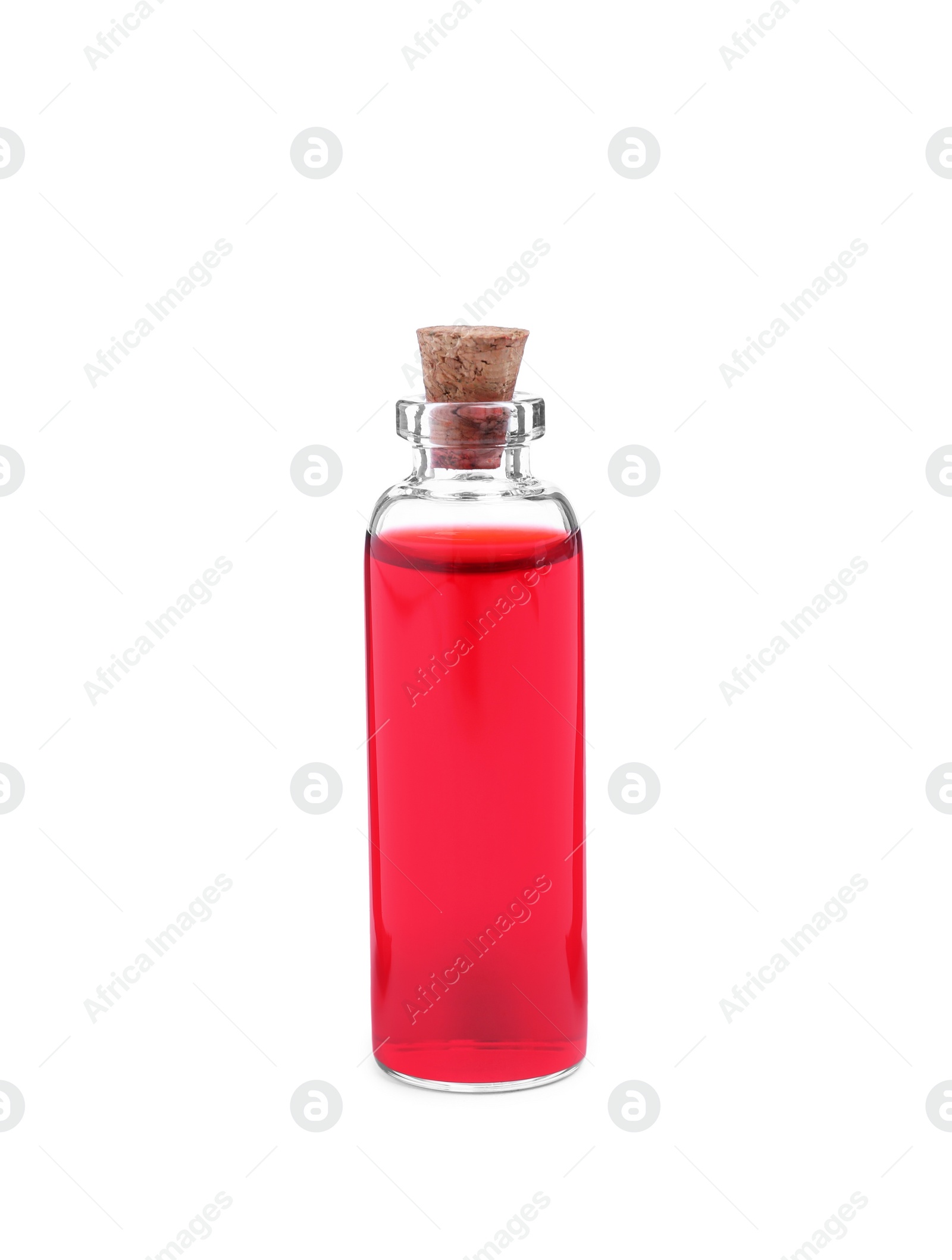 Photo of Glass bottle of red food coloring on white background