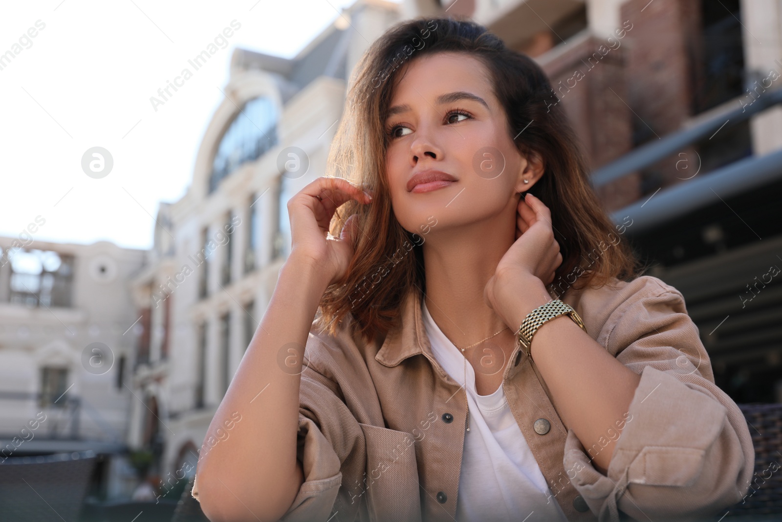 Photo of Portrait of beautiful young woman outdoors on sunny day