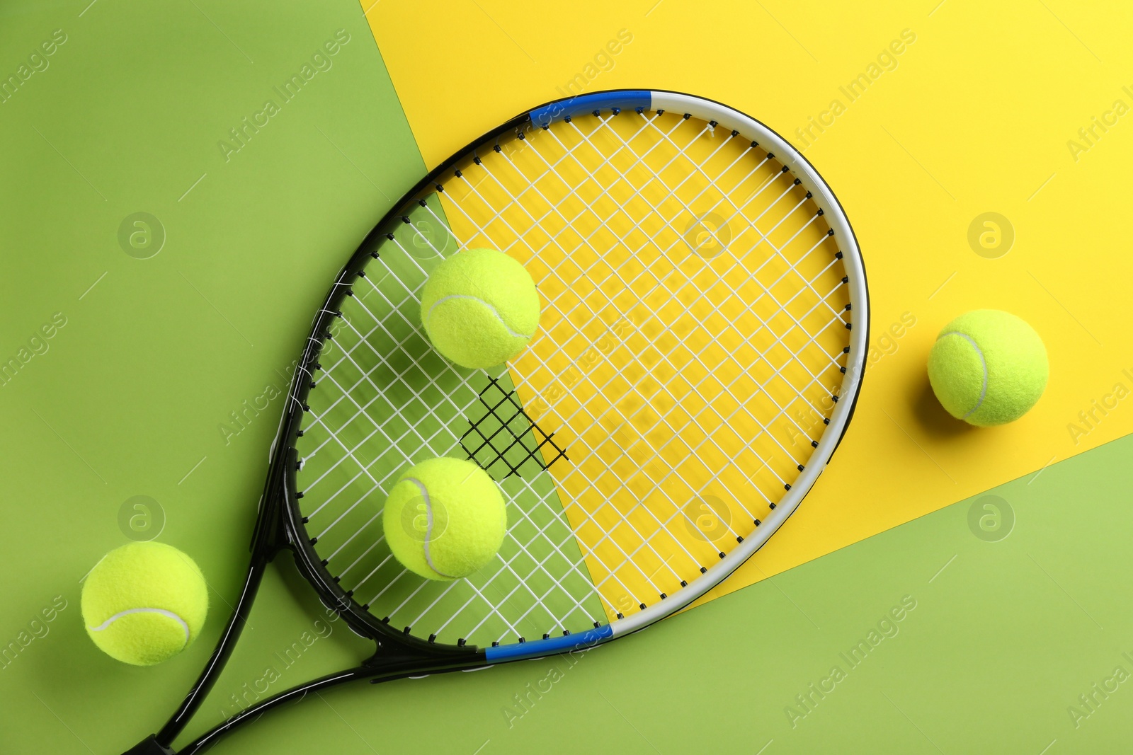 Photo of Tennis racket and balls on color background, flat lay. Sports equipment