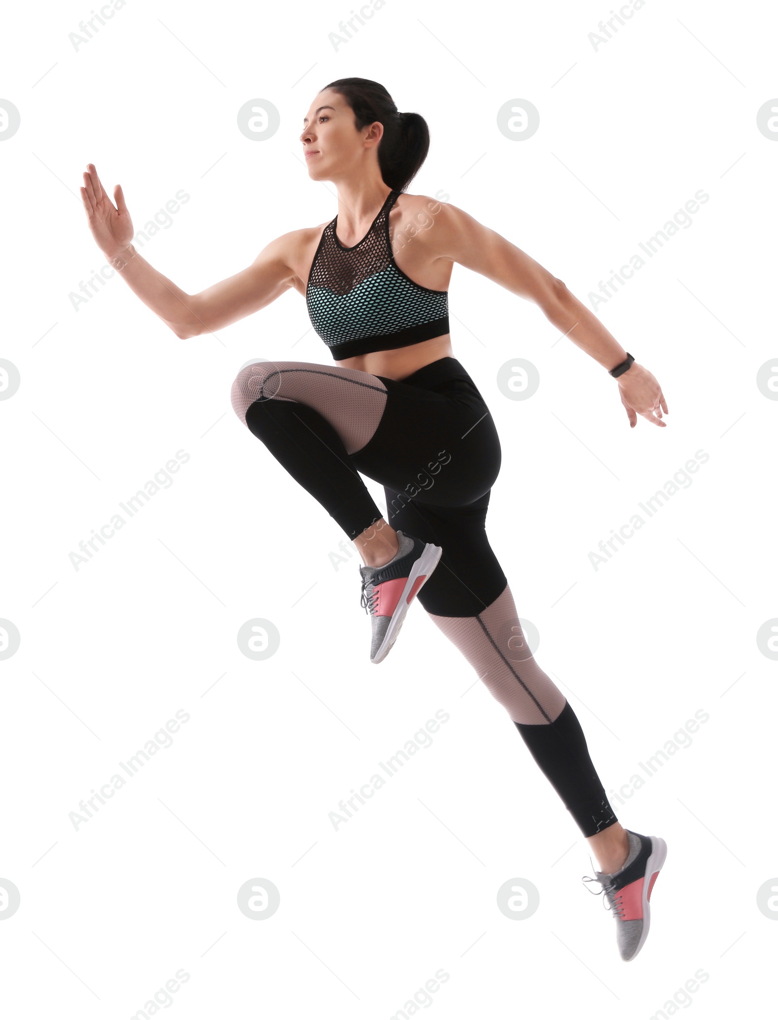 Photo of Athletic young woman running on white background, side view