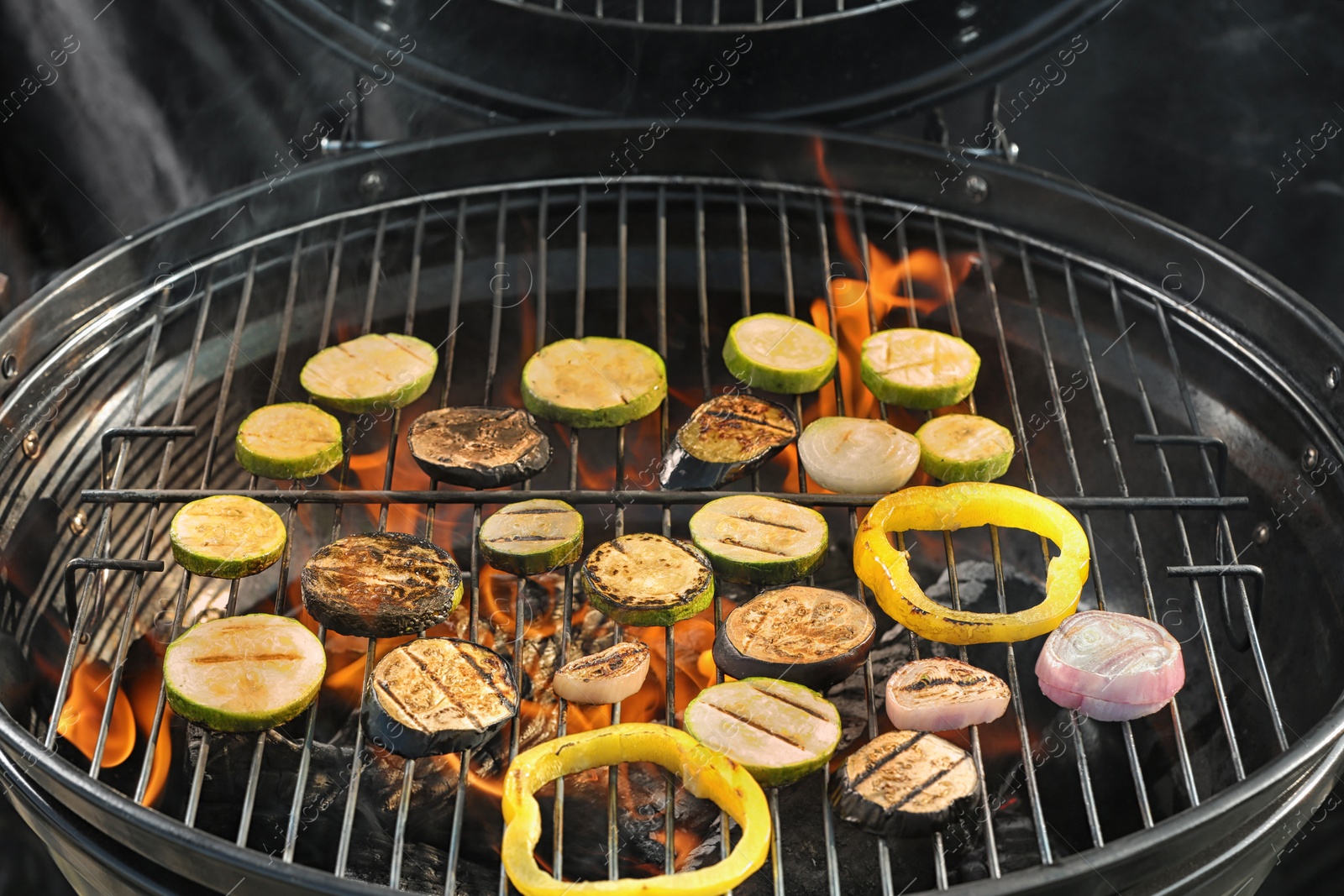 Photo of New modern barbecue grill with different vegetables, closeup