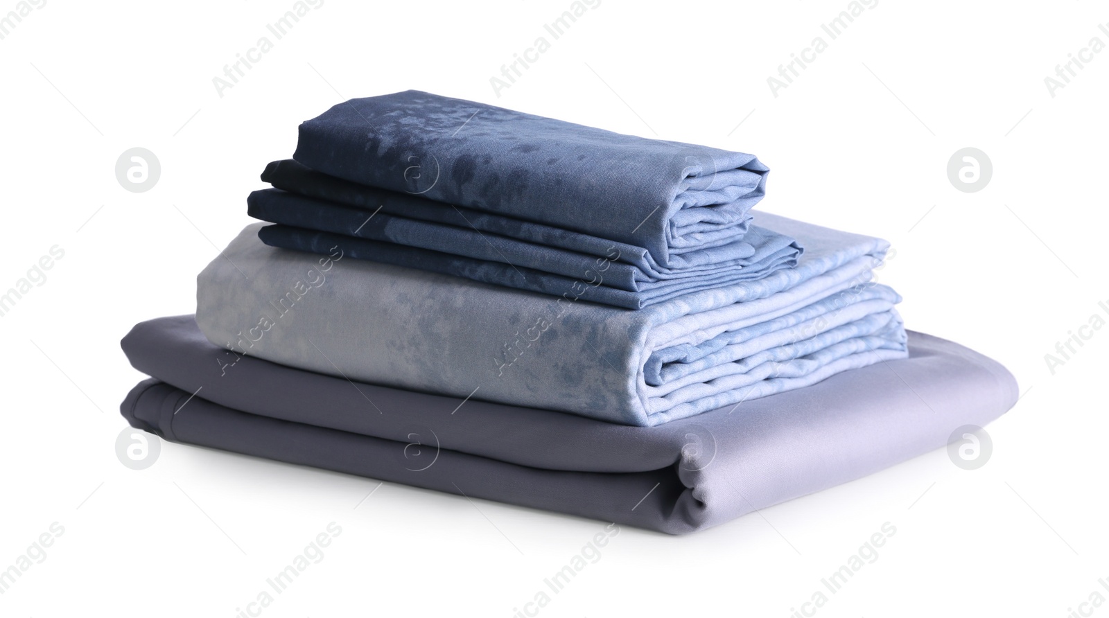 Photo of Stack of clean bed linen isolated on white