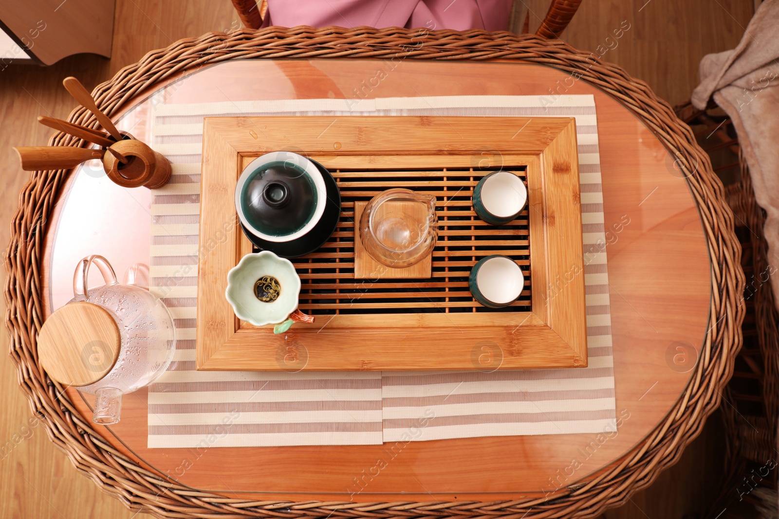 Photo of Beautiful set for traditional tea ceremony on wooden table indoors, flat lay
