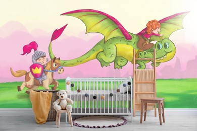 Image of Baby room interior with crib and decor. Fairytale themed wallpapers with knight, dragon and princess
