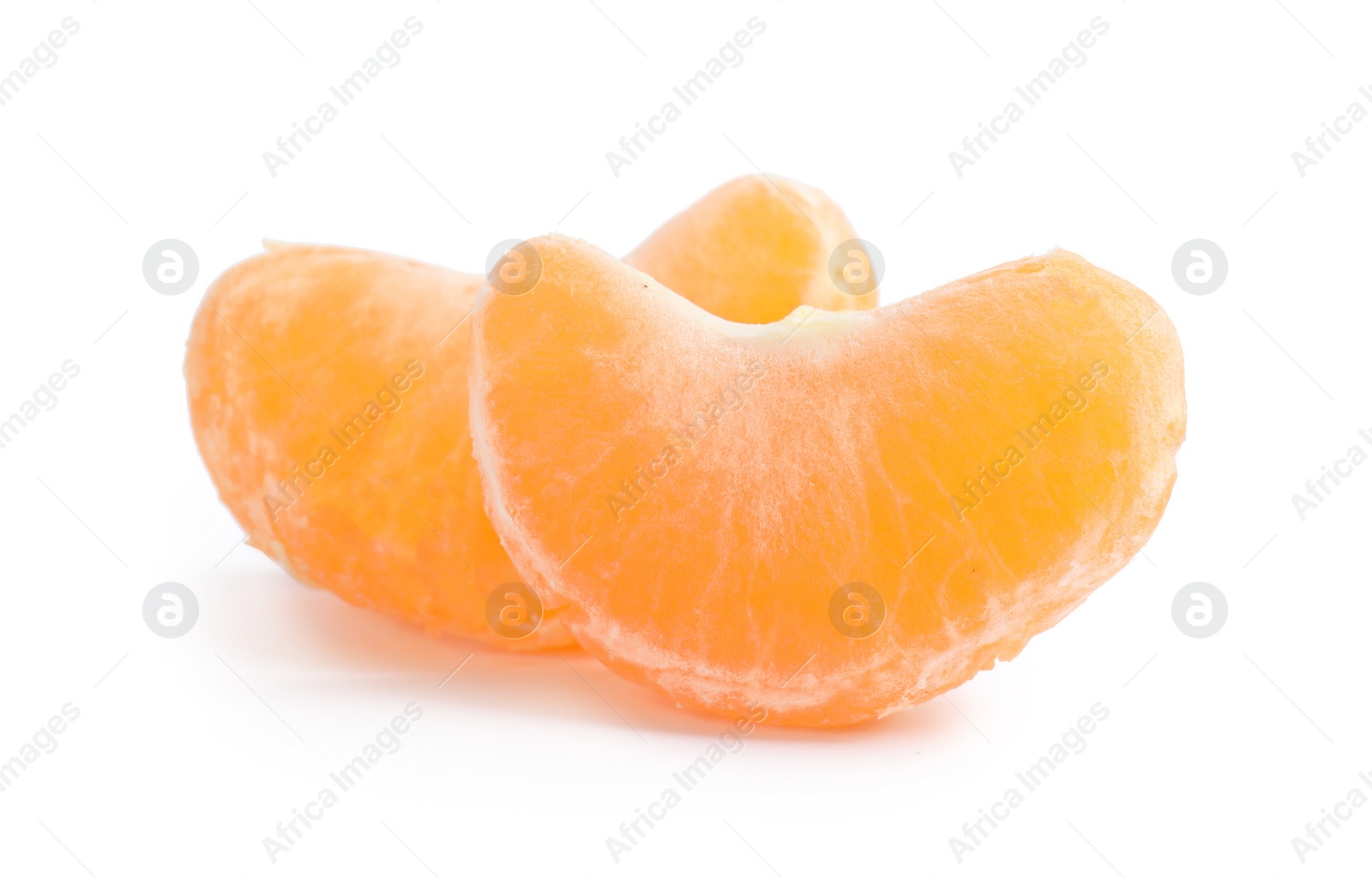 Photo of Pieces of ripe tangerine on white background