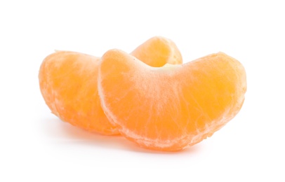 Photo of Pieces of ripe tangerine on white background