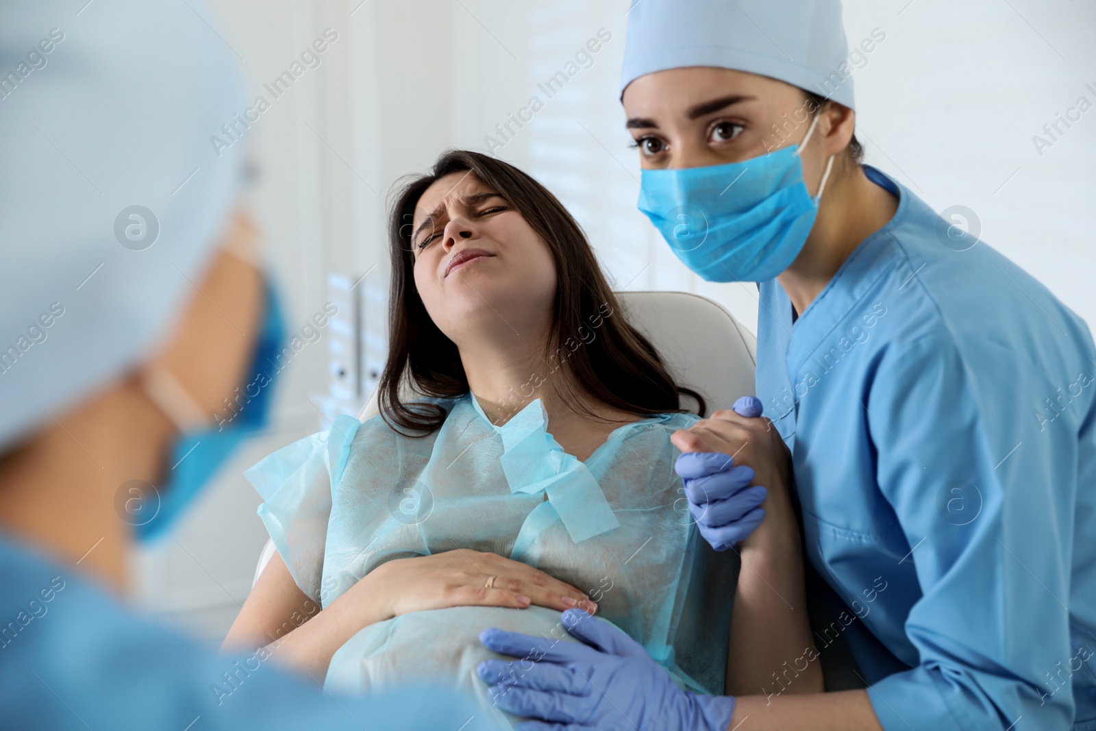 Photo of Woman giving child birth in maternity hospital