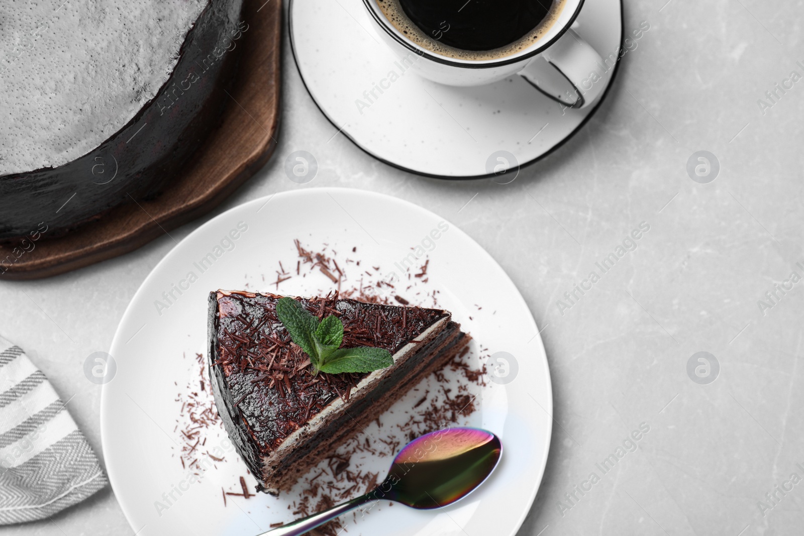 Photo of Tasty chocolate cake on grey table, flat lay