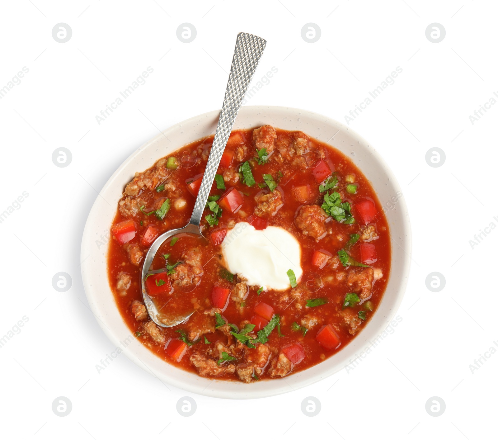 Photo of Bowl of delicious stuffed pepper soup on white background, top view