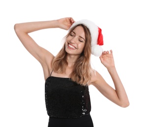 Happy young woman in Santa hat on white background. Christmas celebration