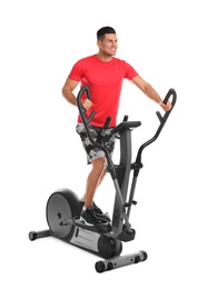 Man using modern elliptical machine on white background