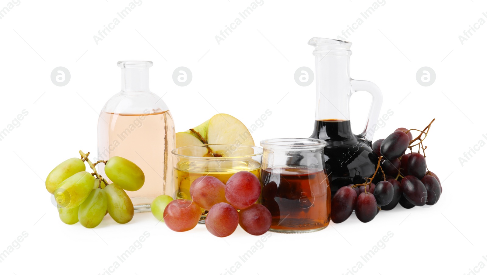 Photo of Different types of vinegar and ingredients isolated on white