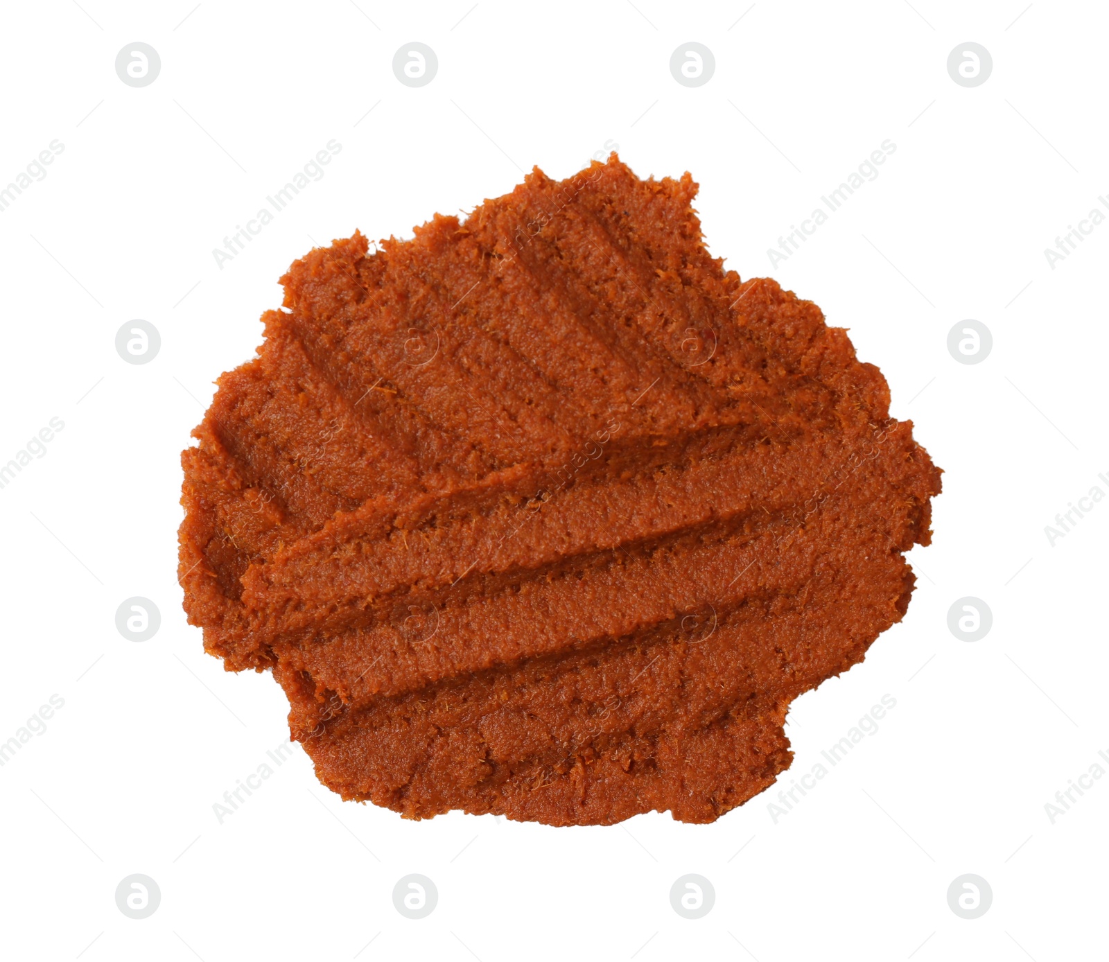 Photo of Red curry paste isolated on white, top view