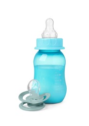 Photo of Feeding bottle with milk and pacifier on white background