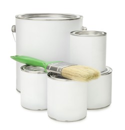 Photo of Paint cans and brush on white background