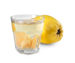 Delicious quince drink in glass and fresh fruit isolated on white