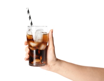 Photo of Woman holding glass of refreshing cola with ice on white background, closeup