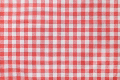 Red checkered tablecloth as background, top view