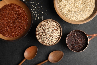 Flat lay composition with different types of quinoa on black background