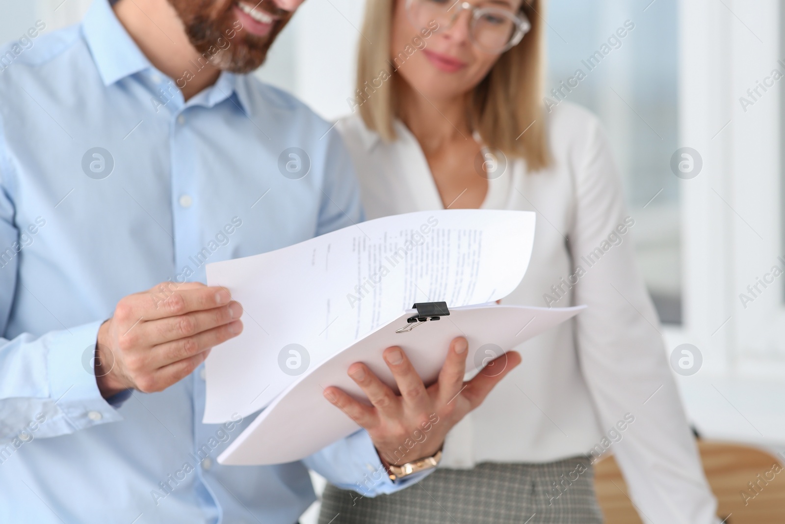 Photo of Businesspeople working with documents in office, closeup