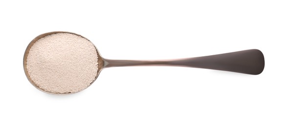Spoon with active dry yeast isolated on white, top view