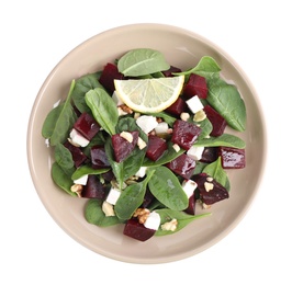 Photo of Delicious beet salad with spinach and feta cheese isolated on white, top view