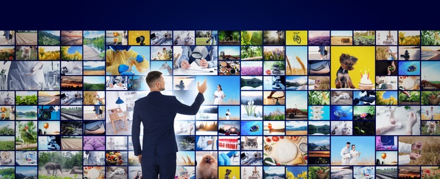 Image of Media library concept. Man using virtual video gallery, banner design