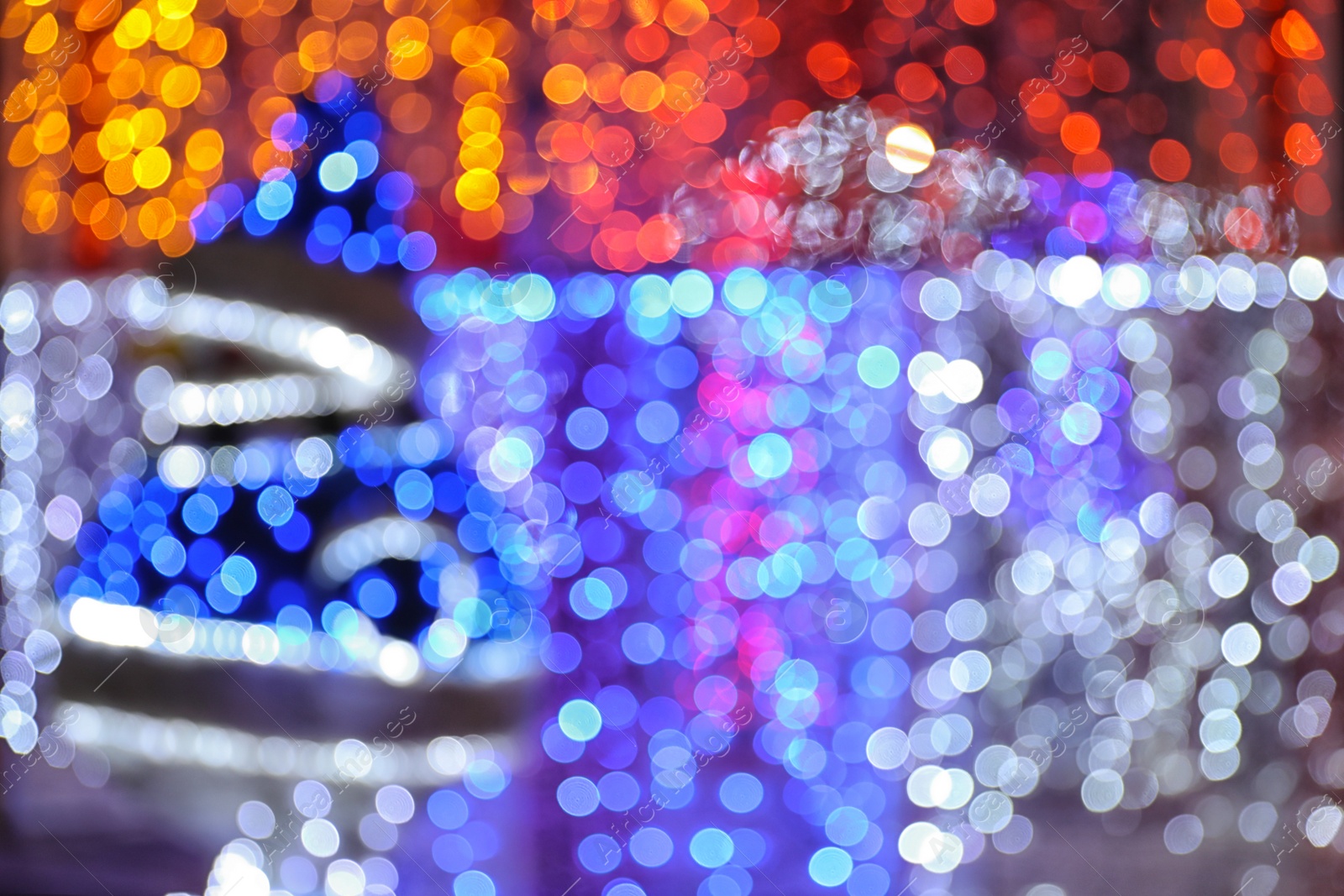 Photo of Blurred shiny lights as background. Bokeh effect