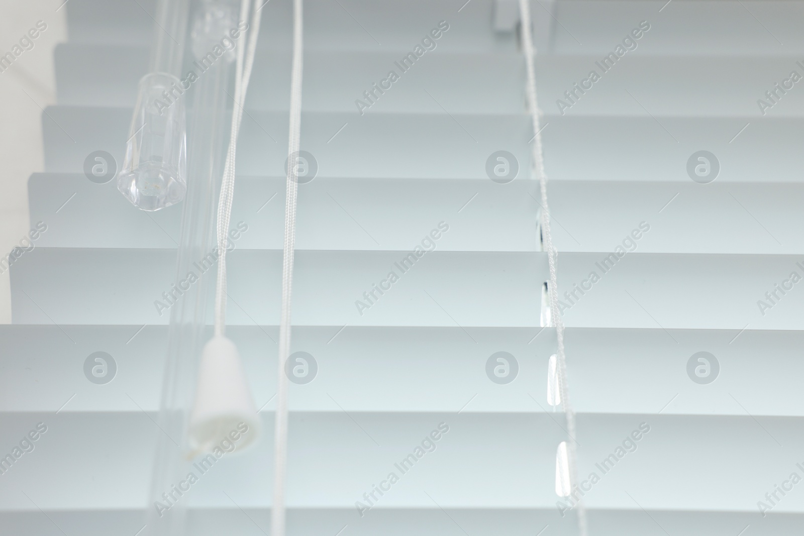 Photo of Closeup view of stylish horizontal window blinds