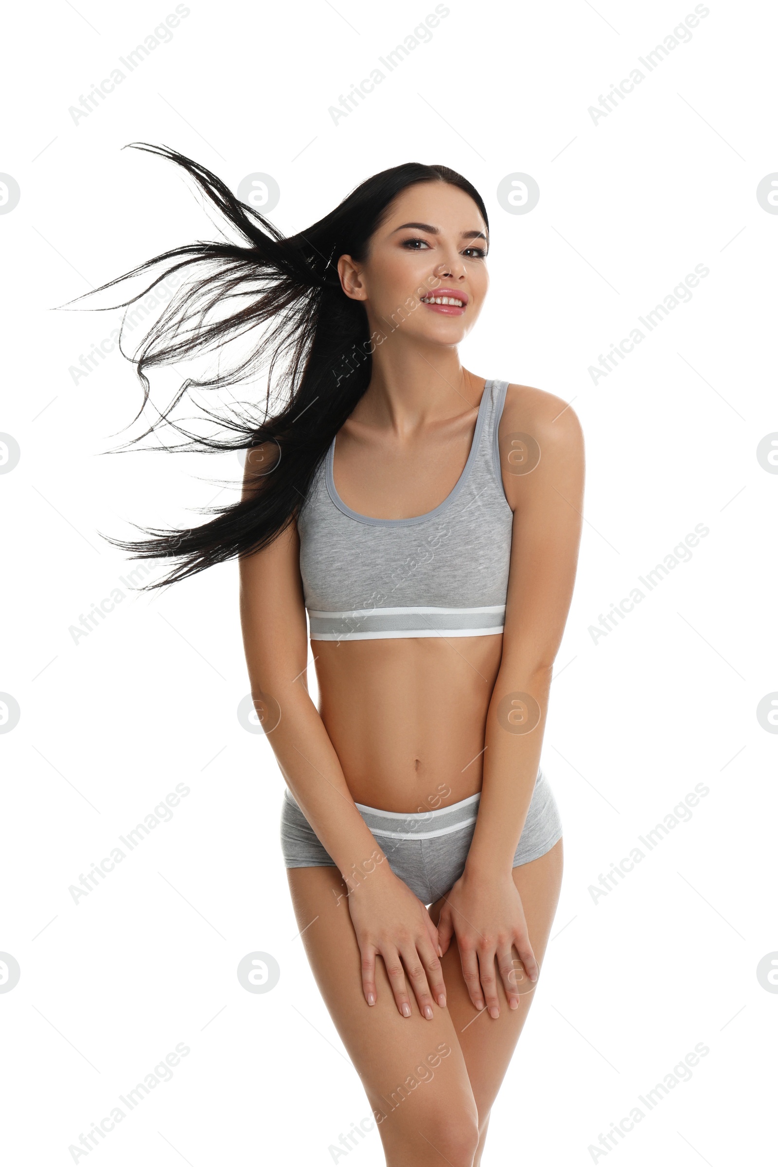 Photo of Beautiful young woman in grey sportive underwear isolated on white