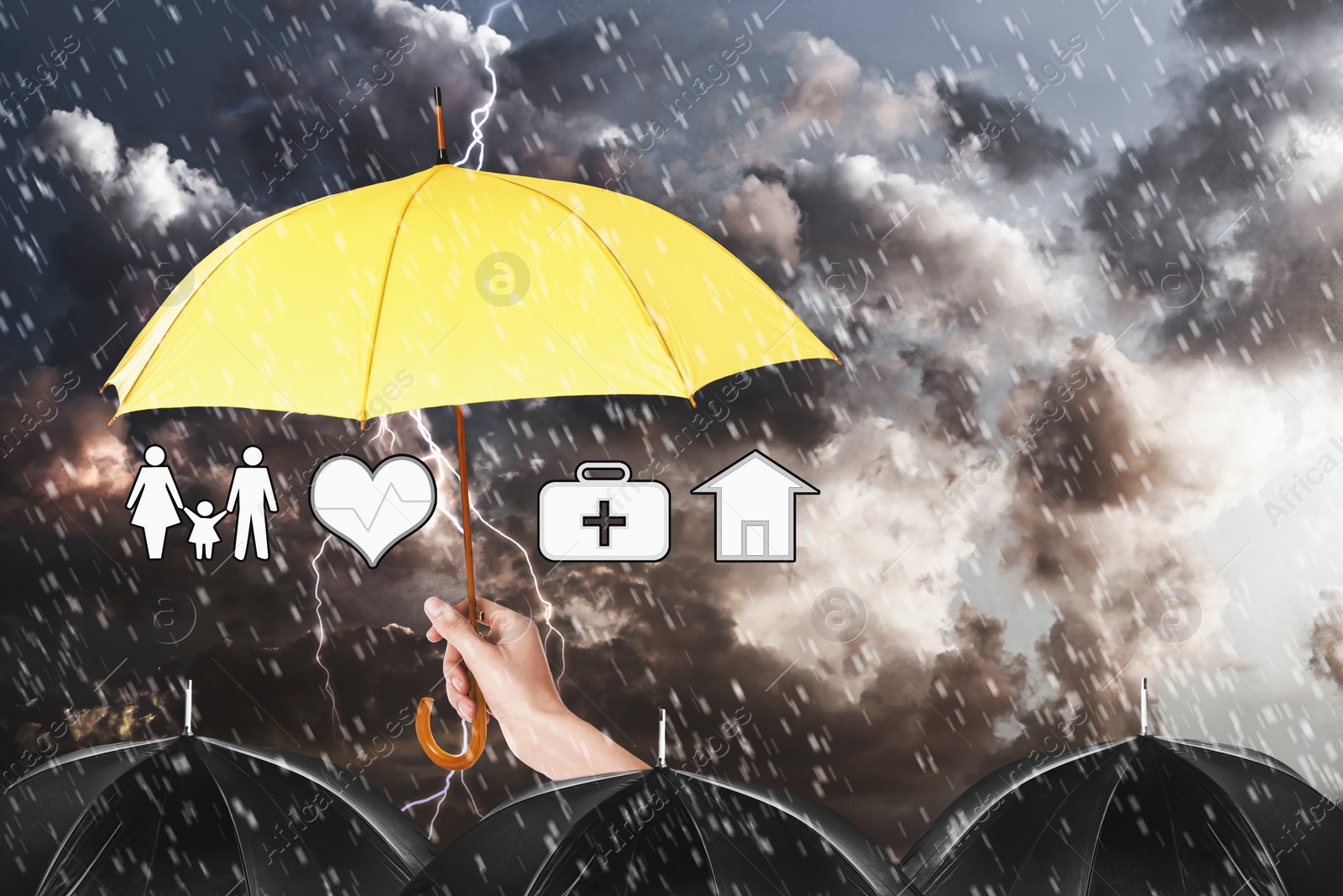 Image of Insurance agent covering illustrations with yellow umbrella during storm