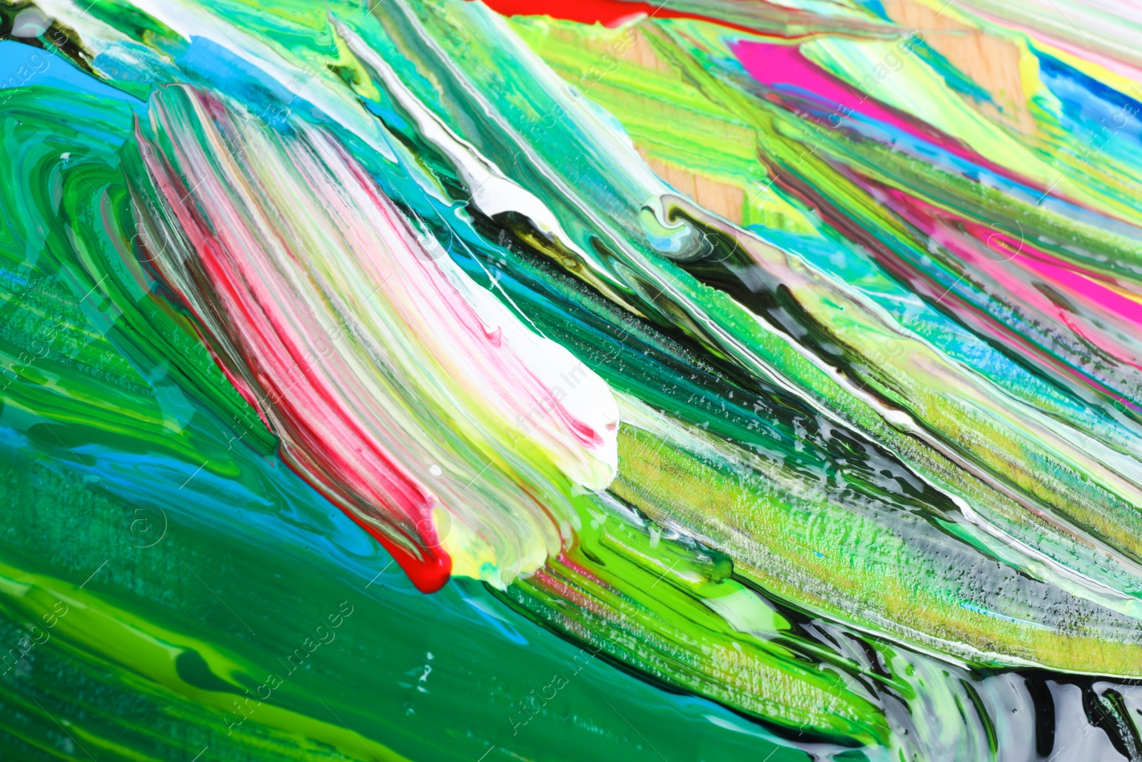 Photo of Abstract colorful acrylic paint as background, top view