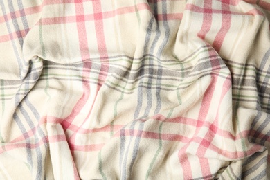 Soft crumpled checkered plaid as background, top view