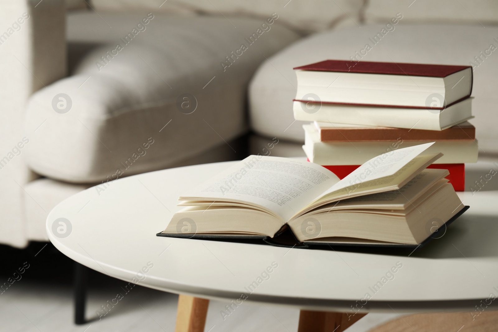 Photo of Many different books on white table indoors, space for text