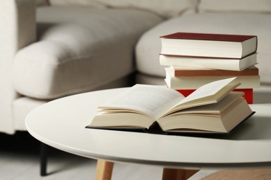 Photo of Many different books on white table indoors, space for text