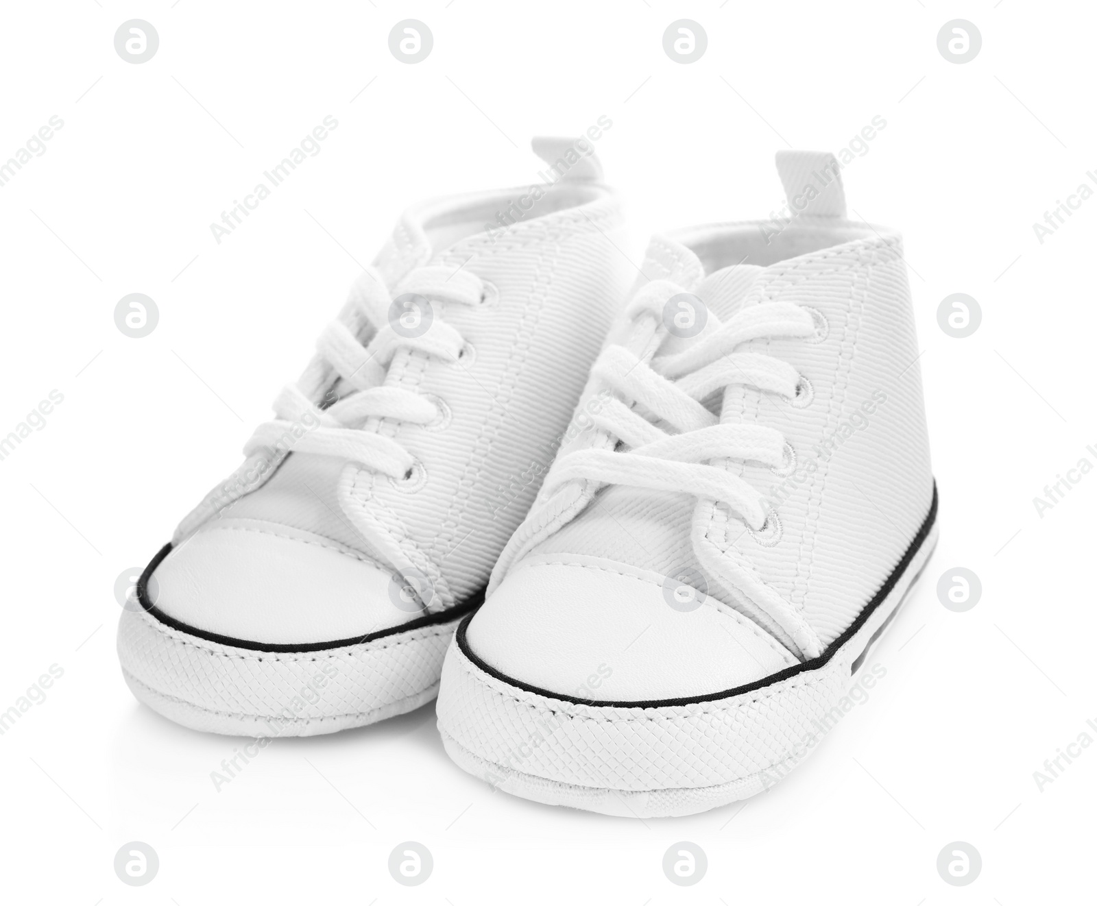 Photo of Pair of casual child shoes on white background