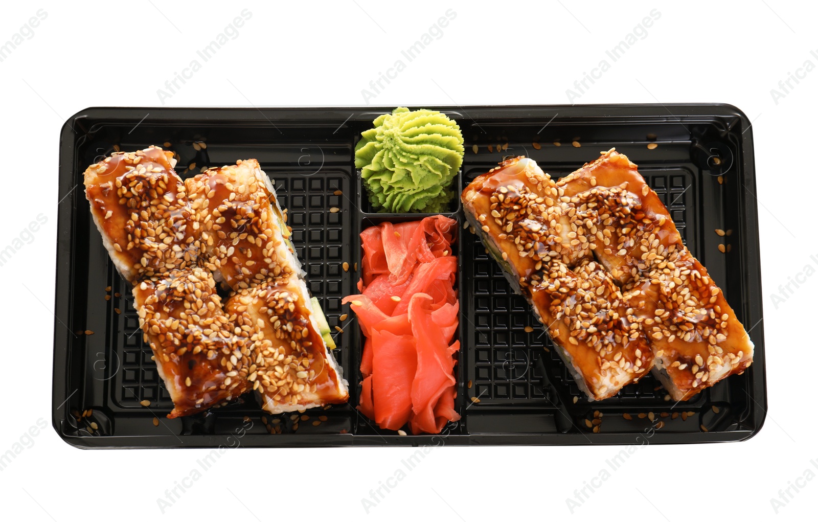 Photo of Box with tasty sushi rolls on white background, top view. Food delivery