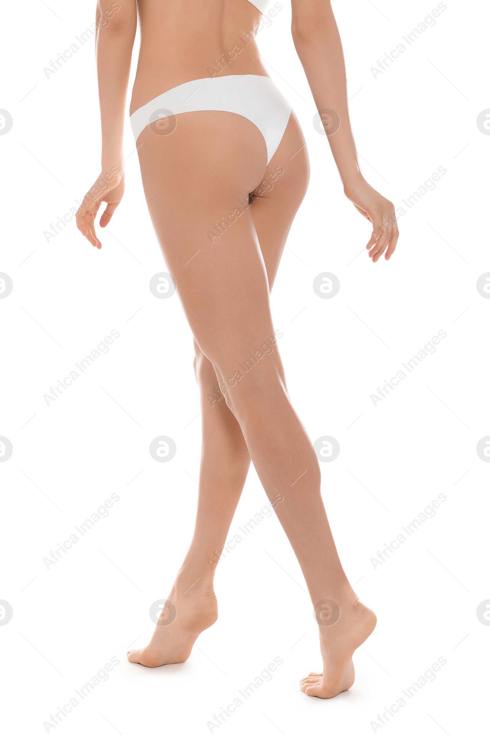 Photo of Slim young woman with smooth skin on white background. Beauty and body care concept
