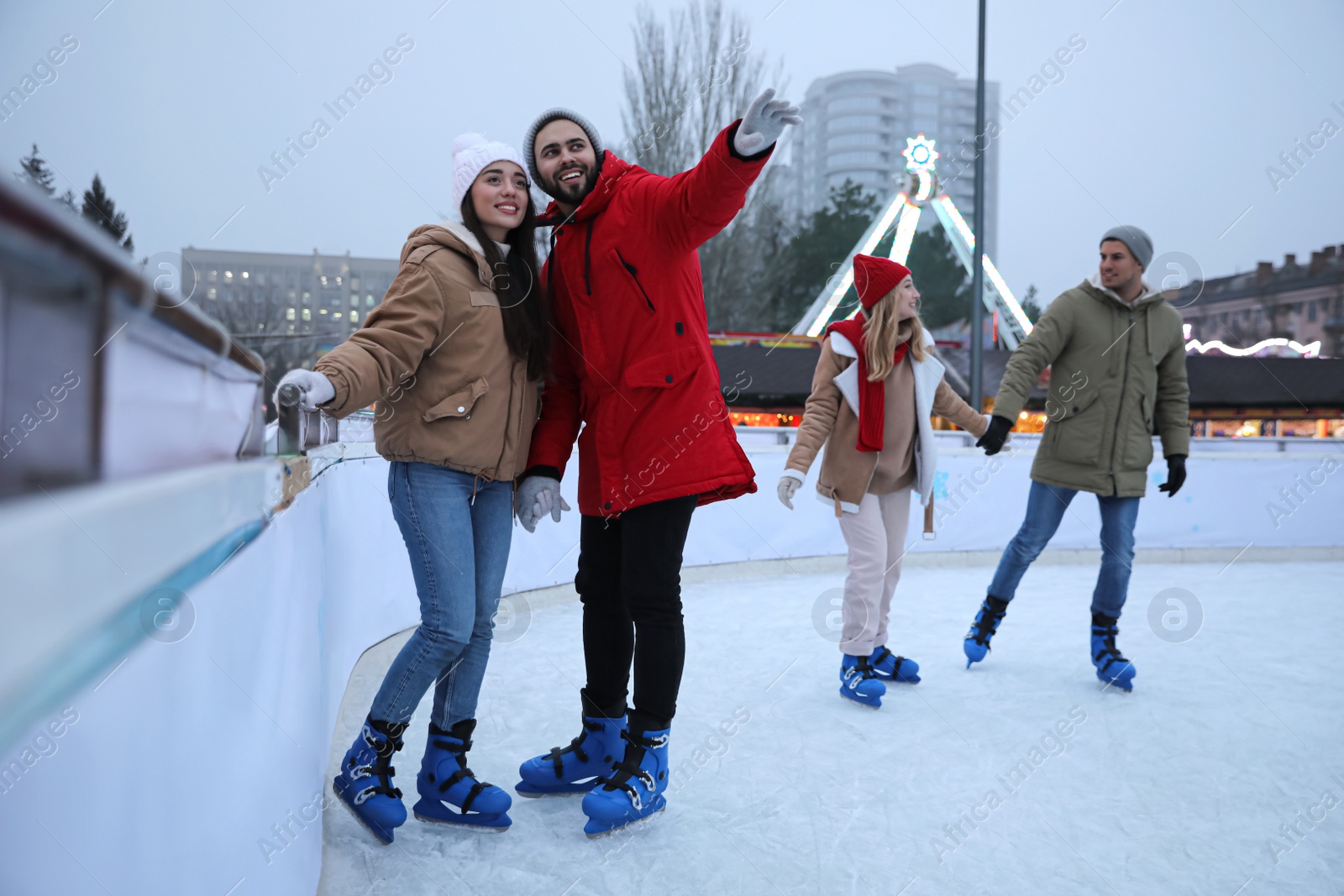 Image of Group of friends at outdoor ice skating rink