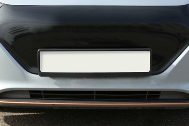 Photo of Car with vehicle registration plate, closeup view