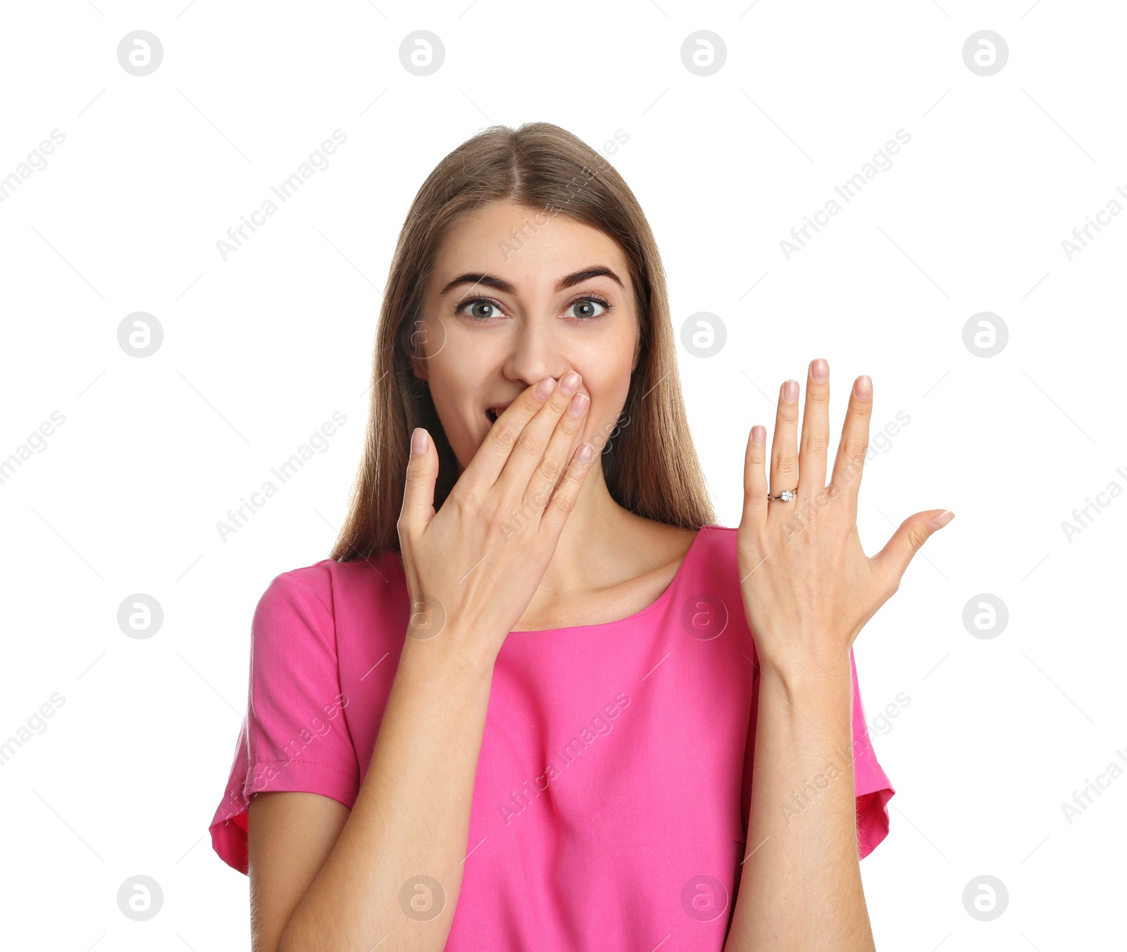 Photo of Emotional young woman wearing beautiful engagement ring on white background