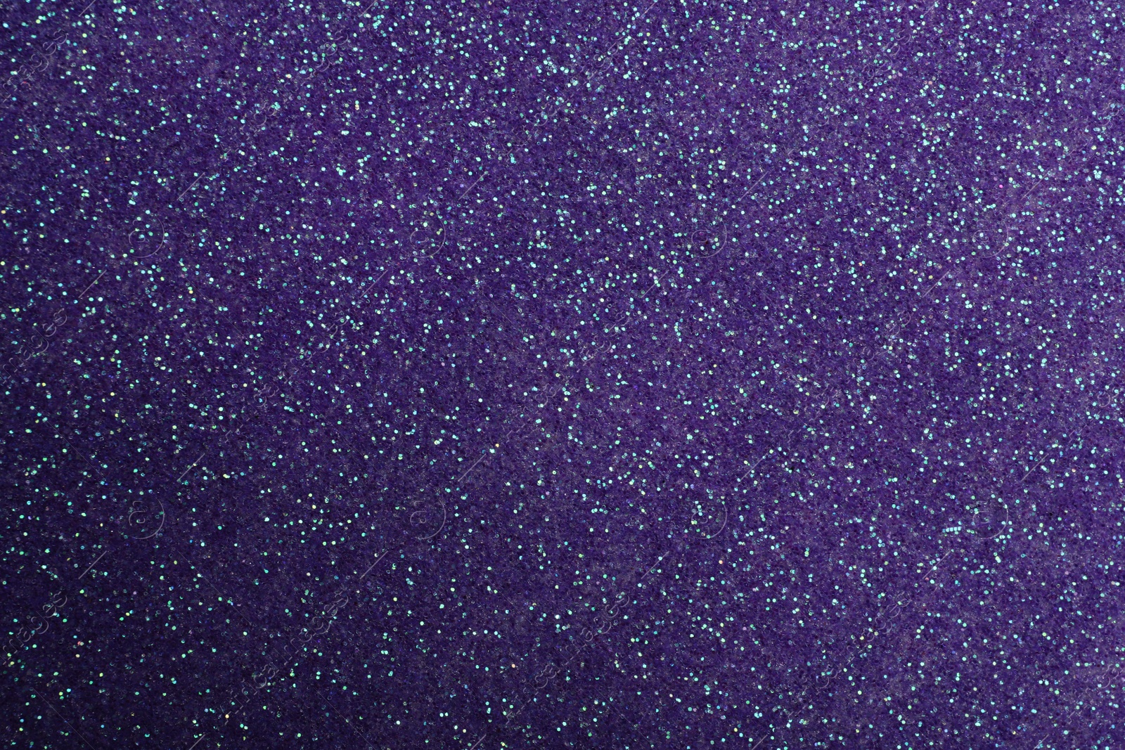 Photo of Beautiful shiny violet glitter as background, closeup