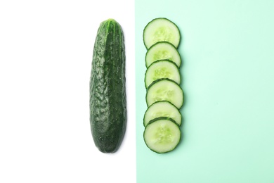 Photo of Flat lay composition with cut cucumber on color background