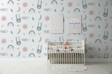 Image of Minimalist room interior with baby crib and cute wallpapers
