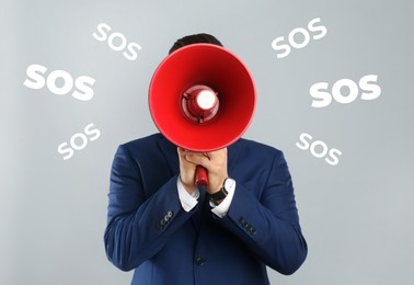 Image of Man with megaphone and words SOS on grey background. Asking for help