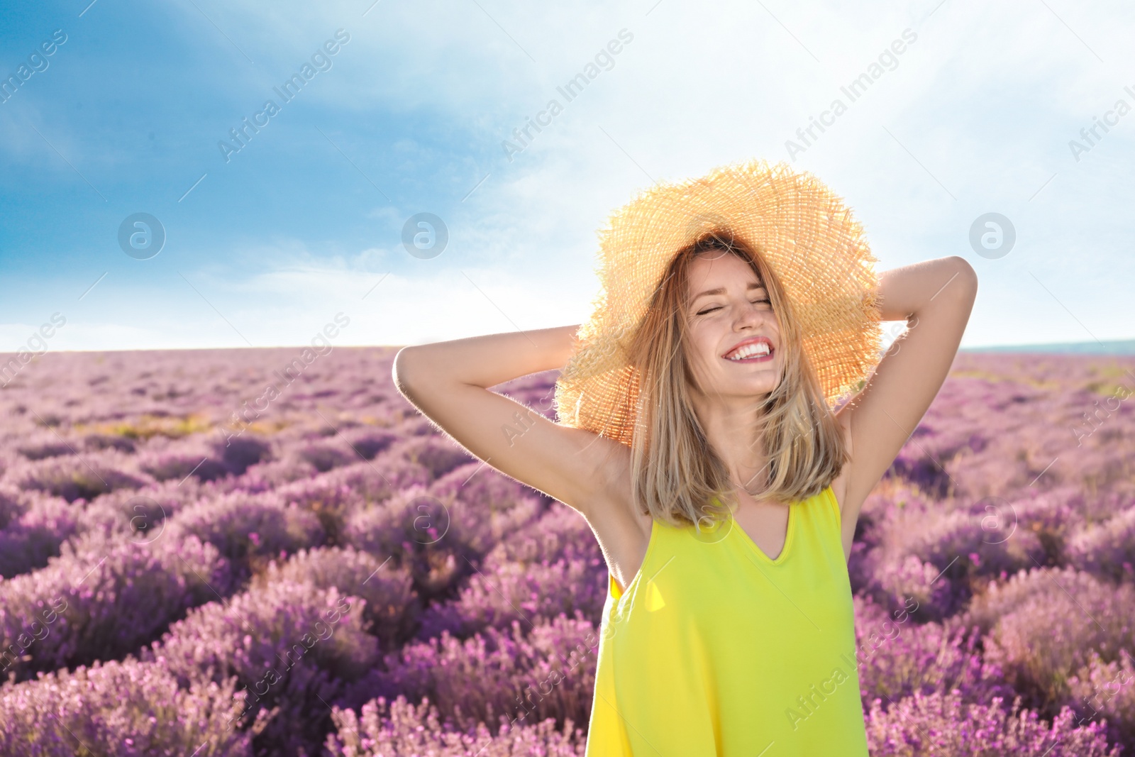 Photo of Young woman in lavender field on summer day