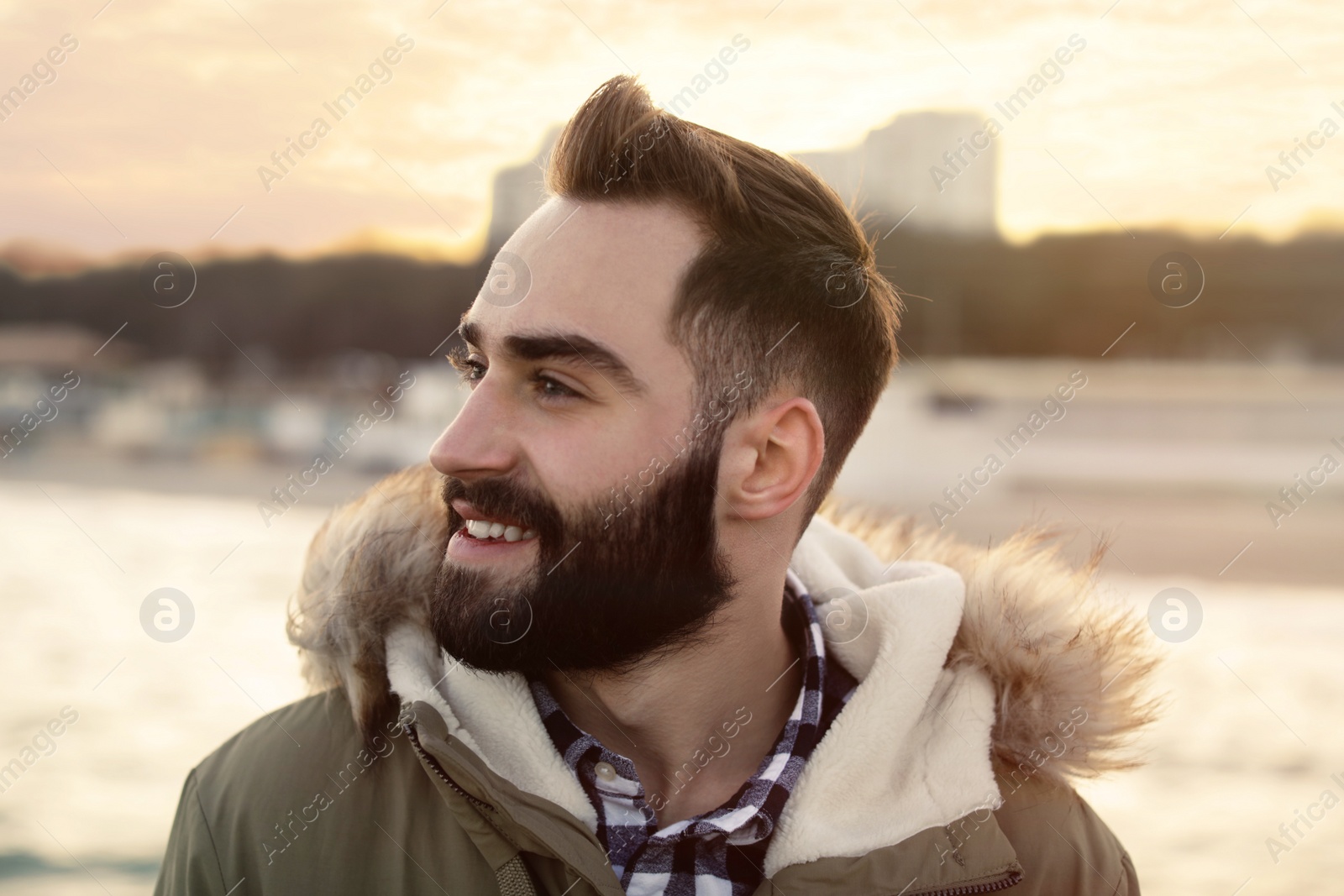 Photo of Portrait of stylish young man near sea