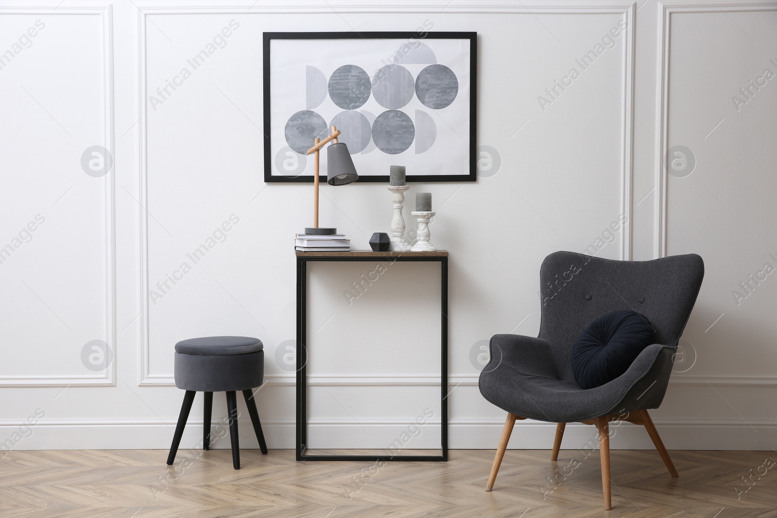 Photo of Hallway with stylish console table and armchair. Interior design