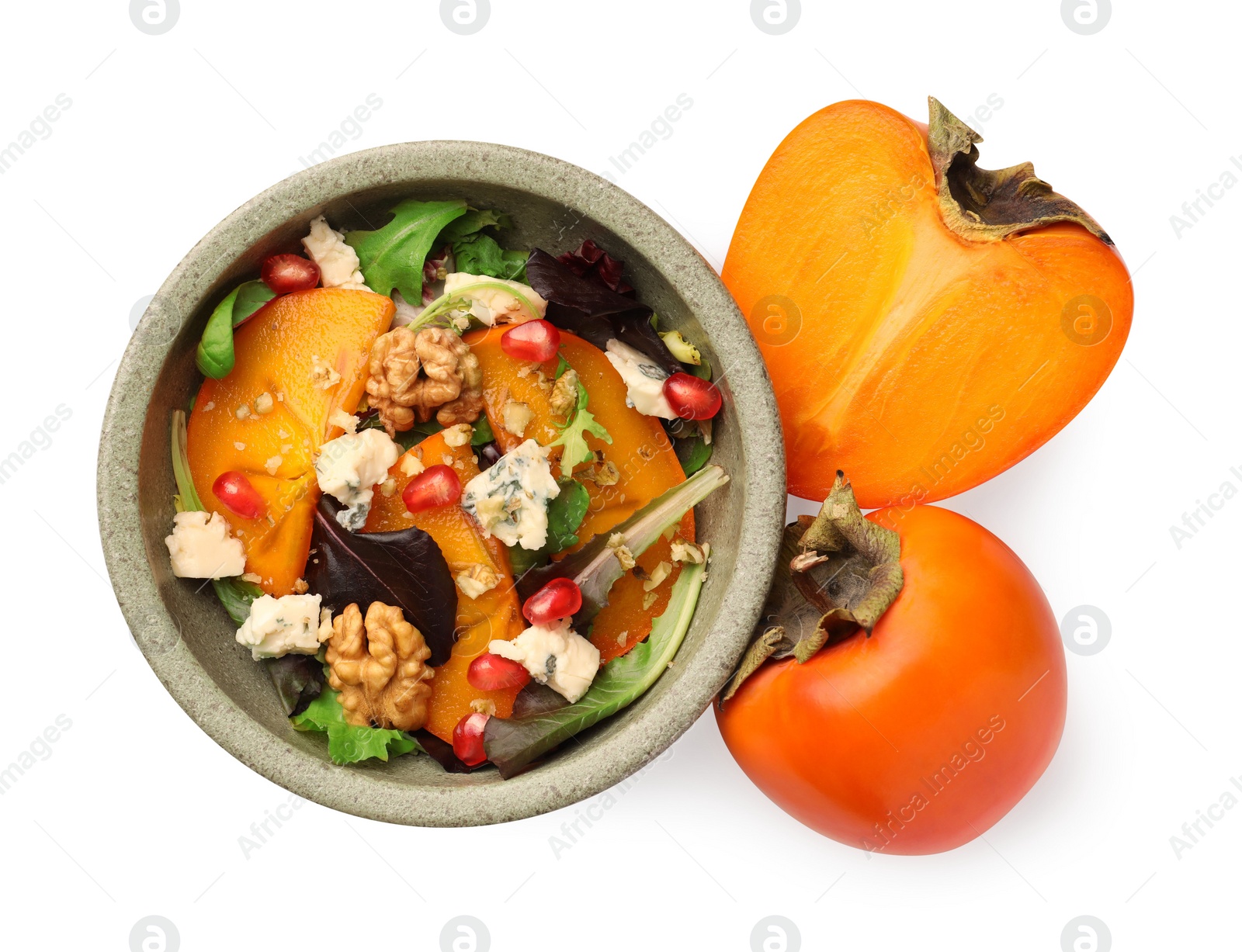 Photo of Bowl with delicious persimmon salad and fresh fruits on white background, top view